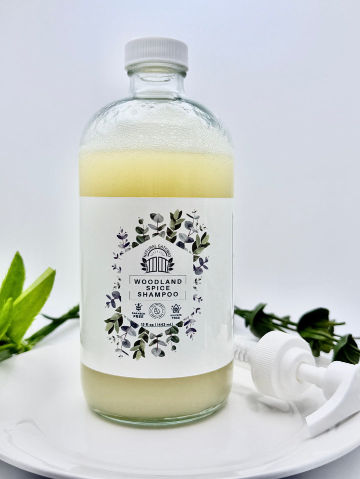 Glass Bottle of Woodland Spice Shampoo with a white pump