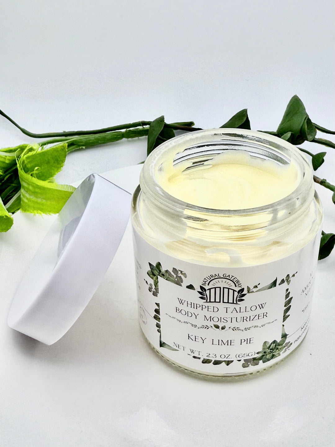 Whipped tallow body moisturizer jar labeled 'Key Lime Pie' With texture shown